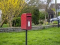 SOMERSET, UK - MARCH 9 2020: Rural Royal Mail mail post box, mailbox. Uneconomic services and deliveries in the country.