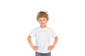 Something unhappy little boy in a white t-shirt on a white background