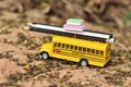 School bus carry the stationery and books on the dirt road Royalty Free Stock Photo