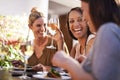 Sometimes all you need is to break the routine and have some fun. Shot of a happy group of friends having a drink Royalty Free Stock Photo