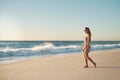 Sometimes the beach is all you need. Shot of a young woman taking a stroll on the beach. Royalty Free Stock Photo