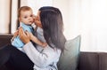 Sometimes the simplest pleasures are the greatest treasures. an adorable baby girl bonding with her mother on the sofa Royalty Free Stock Photo