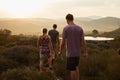 Sometimes you need to get lost to find yourself. Rearview shot of three young hikers on a mountain trail.