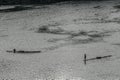 Two fishermen on bamboo boats fishing in the dawn Royalty Free Stock Photo