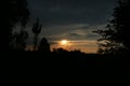 Somewhere on a walk in the evening - sunset from the perspective of a person resting under a tree. Royalty Free Stock Photo