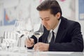 Sommelier degustate wine. Sommelier examination to get certificate professional work of winemaking. Royalty Free Stock Photo