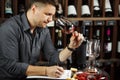 Sommelier degustating red wine poured in glass Royalty Free Stock Photo
