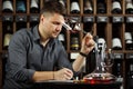 Sommelier degustating red wine poured in glass Royalty Free Stock Photo