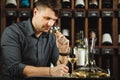 Sommelier degustating white wine poured in glass Royalty Free Stock Photo