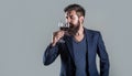 Sommelier, degustator with glass of wine, winery, male winemaker. Man holding glass of champagne in hand. Man with a Royalty Free Stock Photo