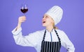 Sommelier enjoy wine. Excellent taste. Sommelier skills. Serving wine at restaurant. Woman chef hold glass of wine