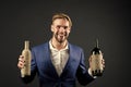 Sommelier hold two bottles of wine. Professional wine degustation concept. Man formal suit with wine bottles in hands