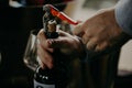 Sommelier opening wine bottle in the wine cellar Royalty Free Stock Photo