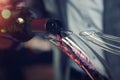 Sommelier pouring red wine into carafe decanter Royalty Free Stock Photo