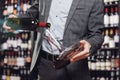 Sommelier pouring red wine into carafe decanter to make aeration drink