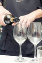 Sommelier pouring wine to the wine glass Royalty Free Stock Photo