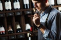Sommelier smelling flavor of cork from red wine Royalty Free Stock Photo