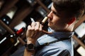 Sommelier smelling flavor of cork from red wine Royalty Free Stock Photo