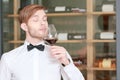 Sommelier testing red wine