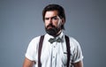 sommelier. true gentleman with groomed hair. male beauty and fashion. barbershop concept. bearded man in tuxedo and Royalty Free Stock Photo