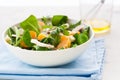 Sommer salad with rocket salad, mandarin, mushrooms and cheese gorgonzola in a white ceramic bowl Royalty Free Stock Photo