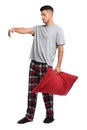 Somnambulist with red pillow on white background. Sleepwalking