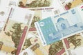 A somoni note from Tajikistan with Russian one hundred ruble bills