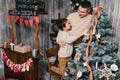 Son and dad decorating the christmas tree at home Royalty Free Stock Photo