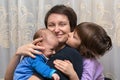 Son and daughter kissing her mother Royalty Free Stock Photo