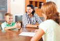 Son and father answer questions of a social worker Royalty Free Stock Photo