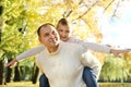 Son and father have fun playing airplanes outdoors on a sunny autumn day Royalty Free Stock Photo