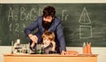 Son and father at school. Wisdom. Back to school. Pharmacy and chemistry theme. solution in research laboratory. Genetic Royalty Free Stock Photo