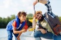 Son feeling surprised while seeing fish caught by father