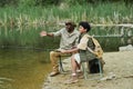 Son fishing together with his dad Royalty Free Stock Photo