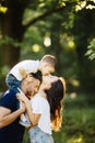 Son give a lovely kiss for mother outside