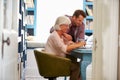 Son Giving Senior Parent Financial Advice In Home Office Royalty Free Stock Photo