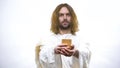 Son of God holding wine, sacramental Eucharist in Catholic church, Communion Royalty Free Stock Photo