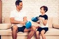 Son Helps Happy Father Wear Blue Boxing Gloves