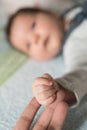 Son holds father by the hand. close-up. Closeup of a senior man and girl holding hands Royalty Free Stock Photo