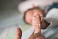 Son holds father by the hand. close-up. Closeup of a senior man and girl holding hands Royalty Free Stock Photo