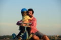 Son hugging Father. Daddy and child playing on summer vacation. Love, fatherhood and family concept. Father`s Day. Child