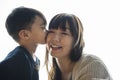 Son kissing cheek his mom with love Royalty Free Stock Photo