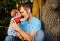 Son kissing his father Royalty Free Stock Photo