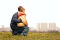 Son on lap of father outdoor Royalty Free Stock Photo