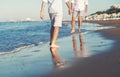 Son legs go to his father on the sea surf line close up image Royalty Free Stock Photo