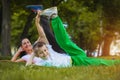 Son and mother are doing exercises in the park