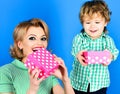 Son and mother with gift box. Happy family with gifts. Mothers day, Valentines day, Christmas, New Year, Birthday concept. Royalty Free Stock Photo