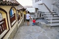 Son and mother walking on street of ?ncient city of Sozopol in Bulgaria Royalty Free Stock Photo