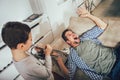 Son wakes up his dad by playing a trumpet