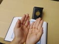 son's hands in mosque praying and reading holly book quran together islamic education concept